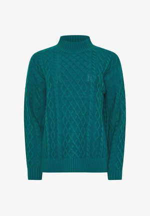 Sinih neulepusero, jossa on korkea ribattua kaulusta, monimutkaisia kaapelikuviota ja pitkät hihat ribatuilla hihoilla ja helmalla.