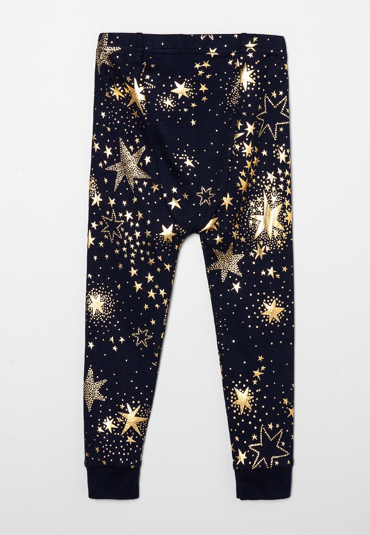 Leggings marine avec un motif d'étoiles et de points dorés, fabriqués à partir d'un tissu doux, avec une taille élastique et un ajustement près du corps aux chevilles.
