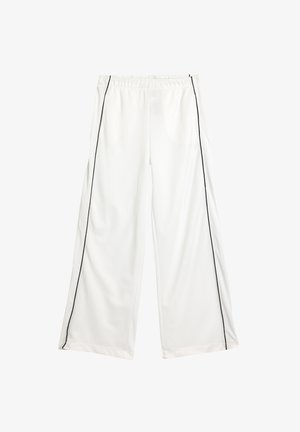 Weiße weit geschnittene Hosen mit einem schwarzen Seitenstreifen, aus glattem Stoff mit einem elastischen Bund und ohne sichtbare Taschen.