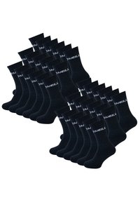 Zwarte katoenen sokken, met ribbeltextuur en wit logo, gerangschikt in een uniform patroon. Meerdere paar samen getoond.