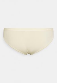 Cuecas femininas beige da Calvin Klein, confeccionadas em tecido suave e elástico, com uma faixa elástica na cintura exibindo o nome da marca em padrão repetido.