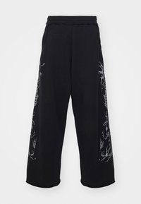 LAZY WILLY MONSTER JOGGER UNISEX - Calças de fato de treino - black