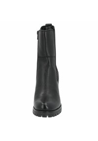 Black leather ankle boot with a smooth texture, rounded toe, side zipper, and rugged sole for traction. Classic design with minimal detailing.