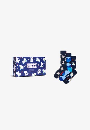 Gaveindpakke mærket "Happy Socks" med hvide hunde- og katteillustrationer, samt tre par blå sokker med hunde-, katte- og argyle-mønstre.