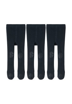 Three pairs of black toddler tights with ribbed texture and white non-slip grip dots on knees and feet, laid flat.