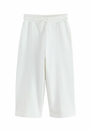 White knee-length shorts with an elastic waistband and drawstring, featuring front pockets and vertical seam details.