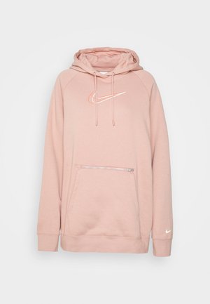 Felpa rosa chiaro realizzata in tessuto morbido, con un tascone frontale a marsupio con zip, cordini e un logo Nike bianco sul petto.