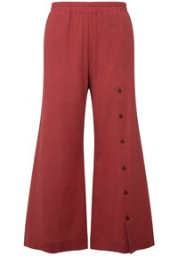 Pantalons larges de couleur rouille avec une taille élastique et de grands boutons marron le long de la couture latérale. Fabriqués à partir d'un tissu léger.