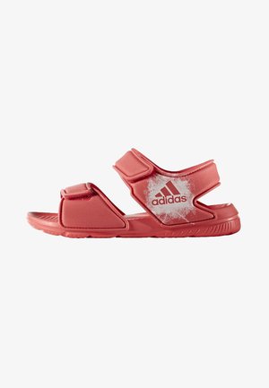 Sandalias rojas de Adidas con correas ajustables de gancho y bucle, parte superior acolchada, suela texturizada y un acento de logo blanco en el lado.
