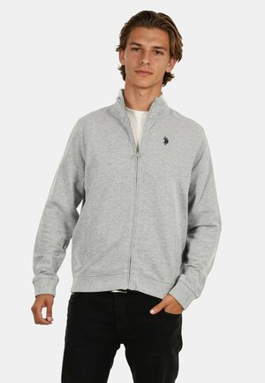 Gray zip-up sweatshirt made of fabric with a smooth texture. Features a stand collar, ribbed cuffs, and a navy logo on the left chest.