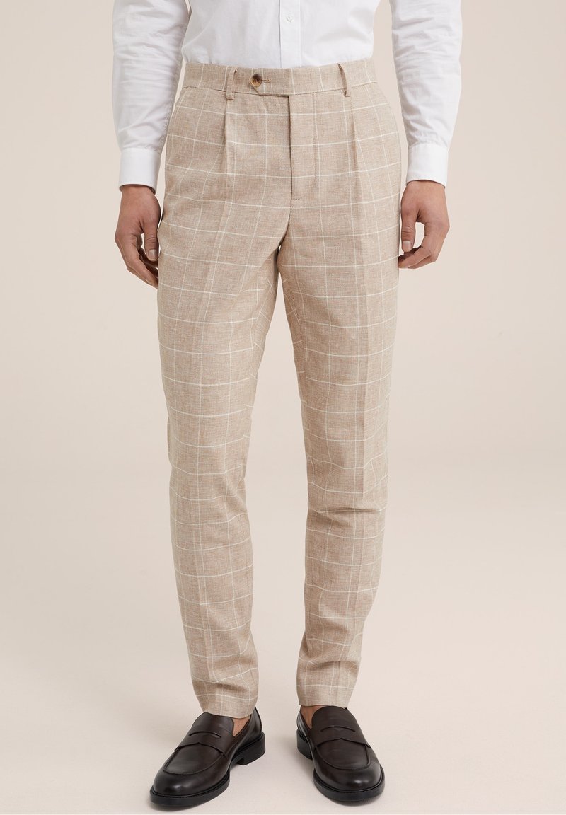 Béžové kostkované kalhoty vyrobené z lnu, s upraveným střihem, klasickými sklady a hladkou texturou. Dokončeny zapínáním na knoflík.