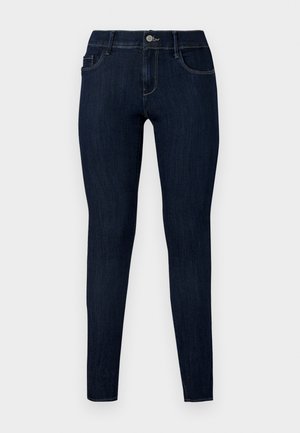 Temno modri skinny jeans iz denima, opremljeni z zapiranjem na gumb spredaj, pasom in štirimi žepi z gladko teksturo.