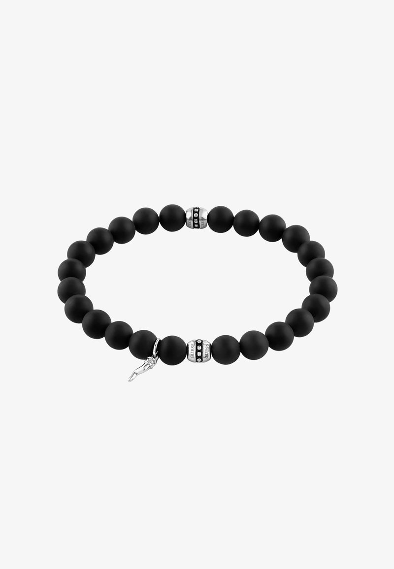 Bracelet à perles noires mates avec deux perles accentuées en argent et un petit pendentif en argent en forme de main levée.