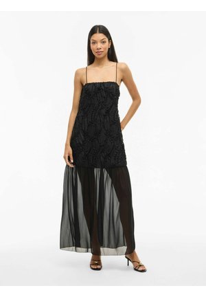Robe noire avec un bodice texturé aux motifs verticaux, des bretelles spaghetti et une jupe maxi en couches transparente.