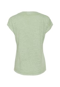 T-shirt verde chiaro a maniche corte realizzato in tessuto testurizzato, con scollatura rotonda e un fit rilassato con orlo leggermente curvato.