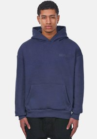 Navy blue hoodie made of soft fabric, featuring a front pocket, ribbed cuffs, and hem; includes the word "DROPSIZE" printed in black.