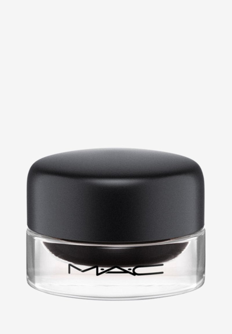 Petit récipient rond en verre clair avec un couvercle noir et le logo MAC, probablement un produit cosmétique comme un eye-liner gel ou une ombre à paupières crème.