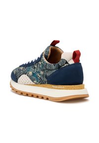 Sneaker with navy fabric upper featuring floral patterns, blue suede toe, and white rubber sole. Red pull tab and light brown speckled midsole.