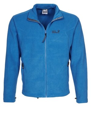 Blå zip-up fleecejakke med høj krave og sidelommer med lynlås, med "Jack Wolfskin" logo på venstre bryst.