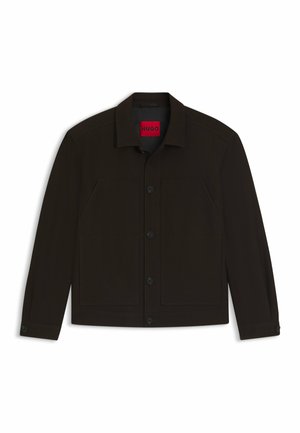 Black button-up jacket with a collar, two front pockets, and contrasting red label inside. Features a smooth texture and tailored fit.