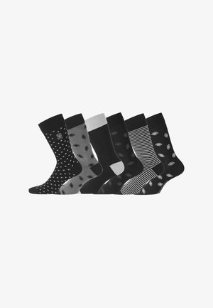 Six paires de chaussettes de type crew en noir et gris avec des motifs variés : pois, feuilles et rayures ; textures mises en évidence et bandes contrastantes.
