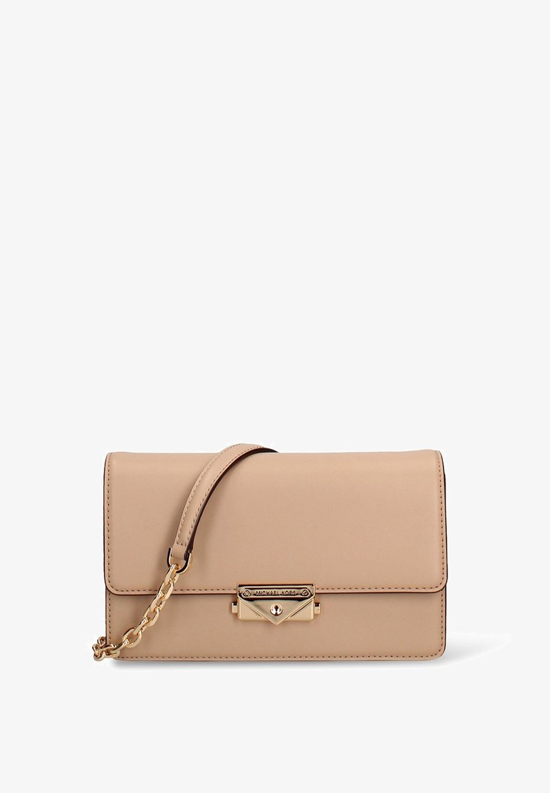 Beige leather handbag with gold hardware, featuring a front flap, chain accent strap, and a smooth texture. Compact rectangular shape.