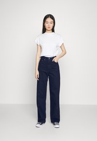 Levi's® HIGH LOOSE - Calças de ganga de perna direita - indigo charm