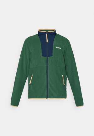 Green fleece jacket with navy accents, high collar, full zipper, and contrasting tan trim; features two front zip pockets.