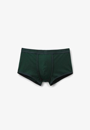 Tmavě zelené boxerky vyrobené z měkké bavlny, s černým elastickým pasem s nápisem "HUMAN" a kontrastními švy.