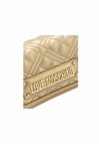 Quilted gold synthetic leather handbag with a prominent "LOVE MOSCHINO" logo plate and studded accents. Smooth texture and curved shape.