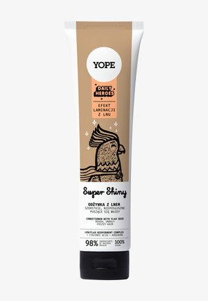 Tube de revitalisant Yope Super Shiny avec un dégradé beige à blanc, illustré d'un oiseau de dessin animé et de texte noir sur une finition mate.