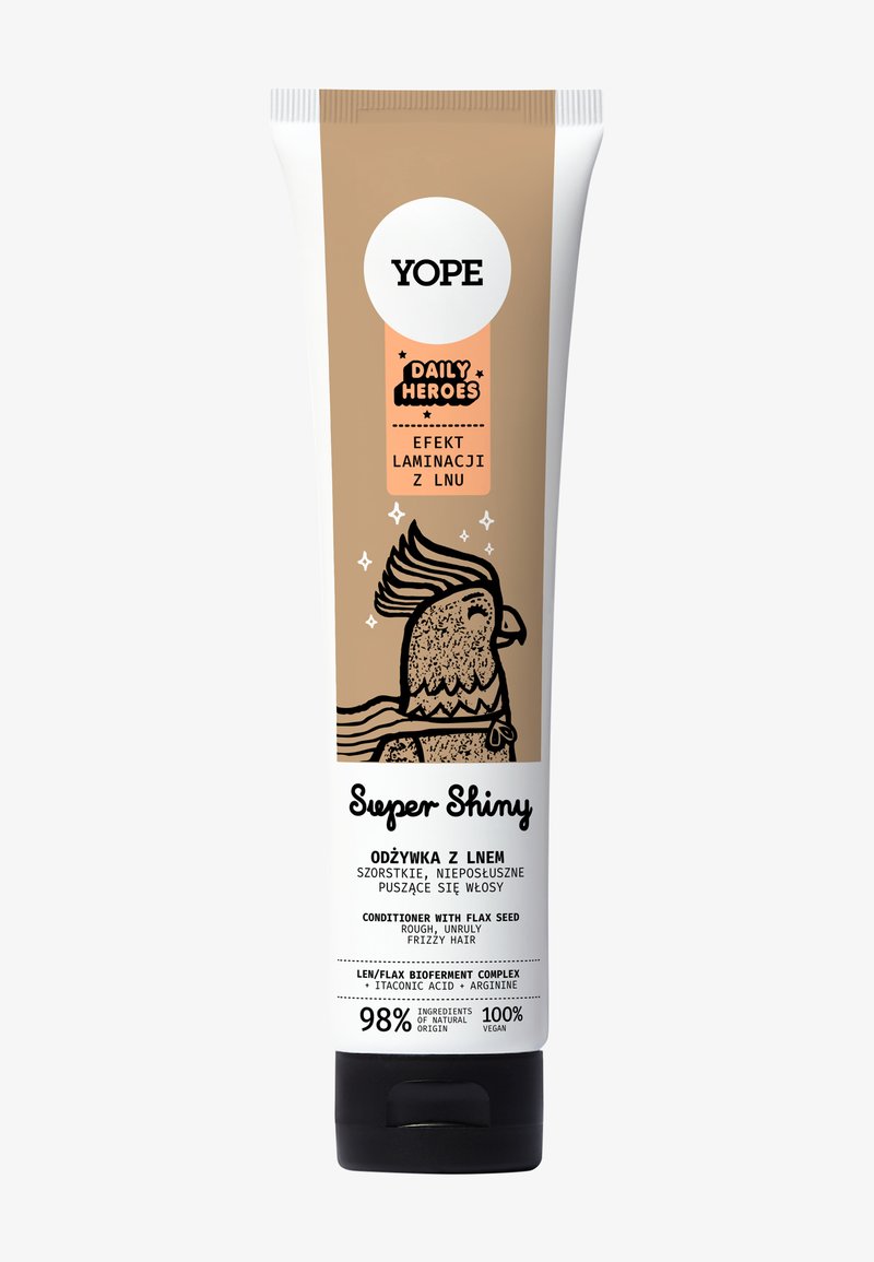 Tube de revitalisant Yope Super Shiny avec un dégradé beige à blanc, illustré d'un oiseau de dessin animé et de texte noir sur une finition mate.
