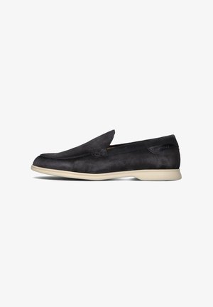 Black suede slip-on shoes with a smooth texture, low profile, and cream-colored sole. Features a subtle logo on the side.