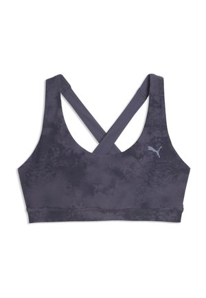 Brassière de sport gris foncé avec bretelles croisées dans le dos et texture subtilement imprimée, avec un petit logo Puma sur le côté gauche.
