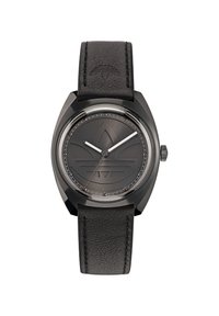 Montre avec bracelet en cuir noir et un cadran rond gris foncé, présentant un design minimaliste, des index horaires en argent et un détail de logo au centre.