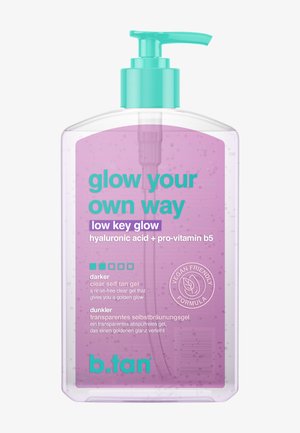 Clear pump bottle of b.tan low key glow self-tan gel with hyaluronic acid, pro-vitamin B5, vegan formula label, and turquoise text and cap.