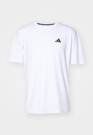 T-shirt blanc à manches courtes en tissu à texture lisse. Présente un logo adidas noir sur le côté gauche de la poitrine et un col à motifs.