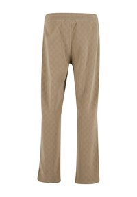 Beige, teksturoitu housut, joissa on timanttimalli, elastisella vyötäröllä ja suoranlahkeinen muotoilu.