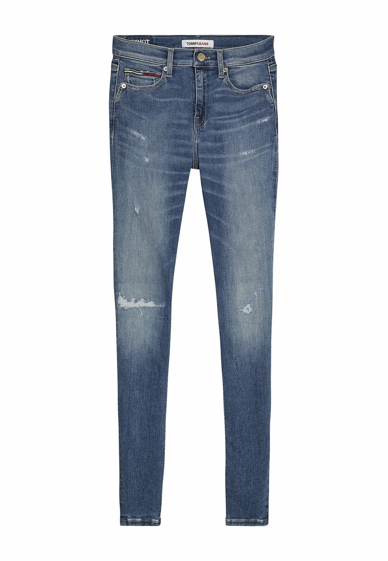 Kapeat farkut vaaleansinisessä farkkukankaassa, jossa on kulutettuja ja rikottuja yksityiskohtia. Varustettu perinteisellä napilla ja vetoketjulla, viidellä taskulla ja logotarralla.