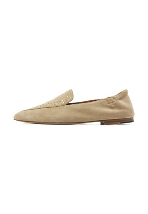 Beige suede flat loafer with small metal studs on the upper, elasticized back, and a low wooden heel.