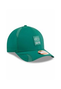 Grüne Baseballmütze mit strukturiertem Design, ausgestattet mit einem Vorderpatch mit der Aufschrift "New York Jets" und Netzakzenten für Atmungsaktivität.