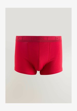 Raudoni medvilniniai bokseriai su lygiu paviršiumi, turintys platų juosmenį, ant kurio išryškintas prekės ženklas "NEXT" tamsesne raudona spalva.