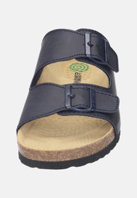Navy blue leather sandal with two adjustable buckles, contoured beige footbed, textured sole, and cork midsole.