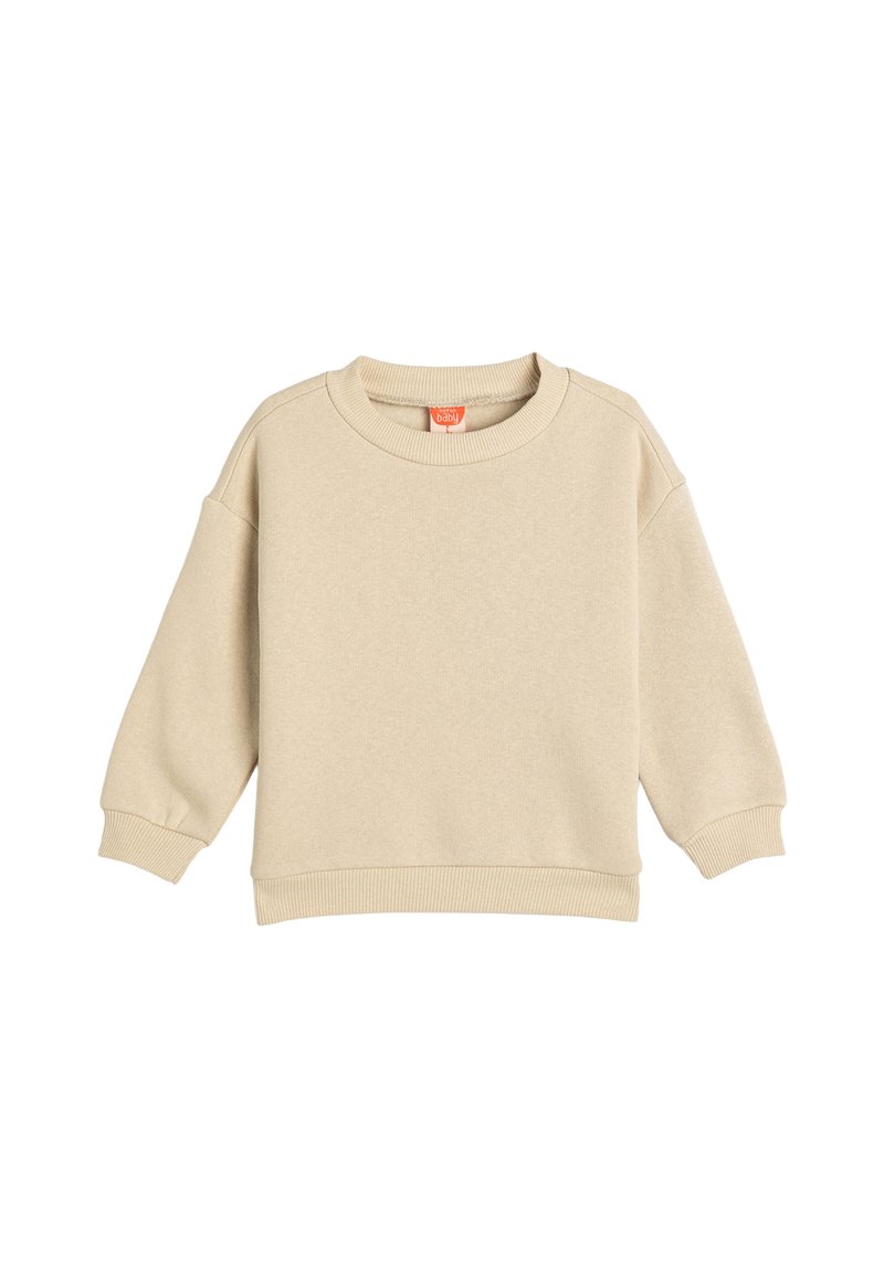Beige sweatshirt i mjukt tyg med rund hals, sänkt axel och ribbad mudd och nederkant. Inga mönster eller ytterligare detaljer synliga.