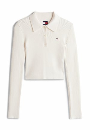 Crème ribbel langemouw gepolocheerde shirt met drie knopen en klein Tommy Jeans-logo op de linkerkant van de borst.