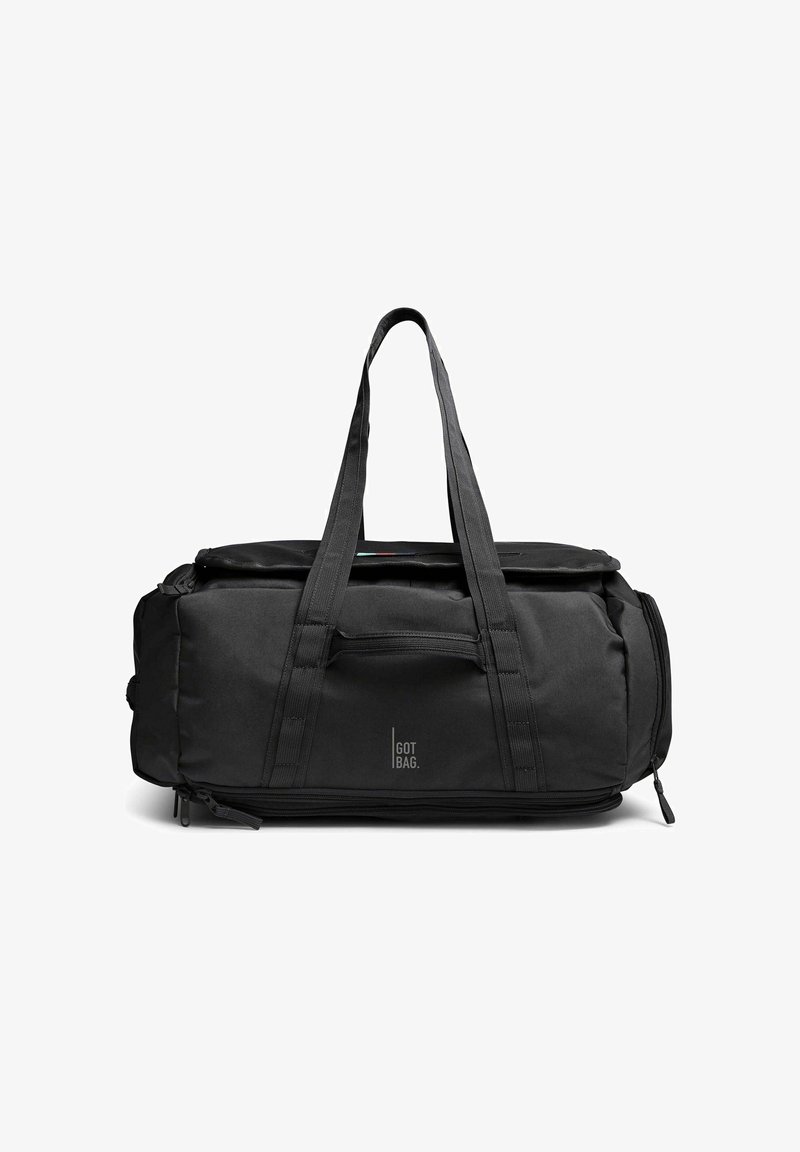 Sac de voyage rectangulaire noir avec deux poignées, logo avant "GOT BAG" et poches zippées sur les côtés, présenté sur un fond blanc.