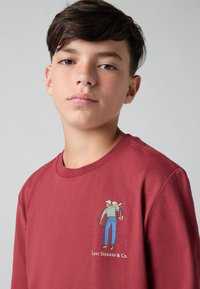 Levi's® SADDLE MAN - Top s dlhým rukávom - red pear