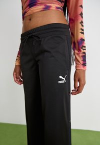 Puma CLASSICS POPPER - Trainingsbroek - black