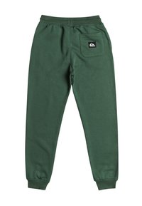 Pantalones de chándal de felpa verde con puños acanalados, cinturilla elástica y un bolsillo en la parte trasera derecha. Presenta una pequeña etiqueta de logo en el bolsillo.