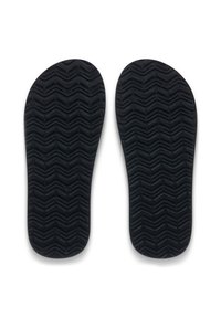 Semelles intérieures noires avec un motif en texture ondulée. Les semelles présentent une forme profilée pour soutenir la voûte plantaire.